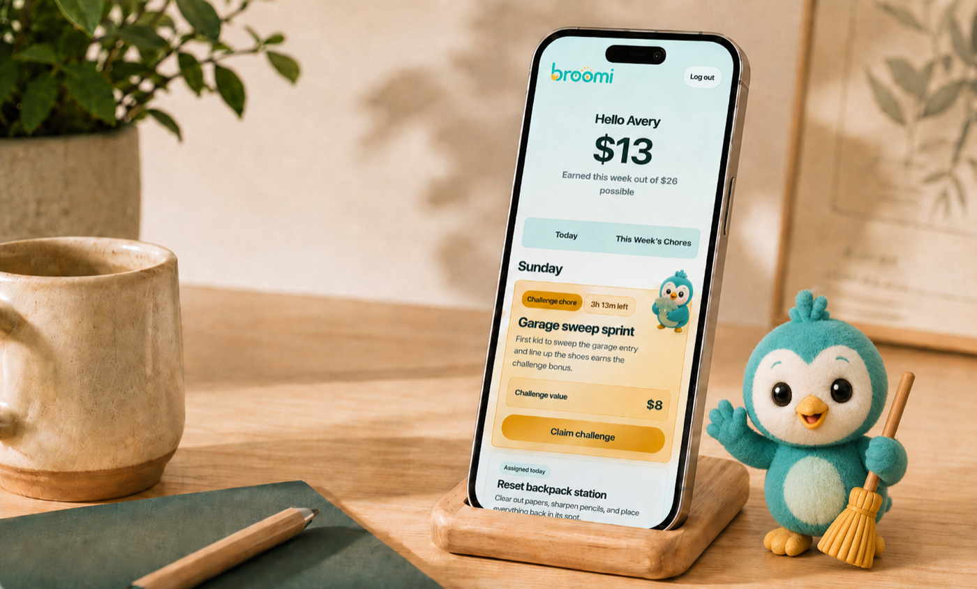 Broomi app open on a phone beside the Broomi mascot